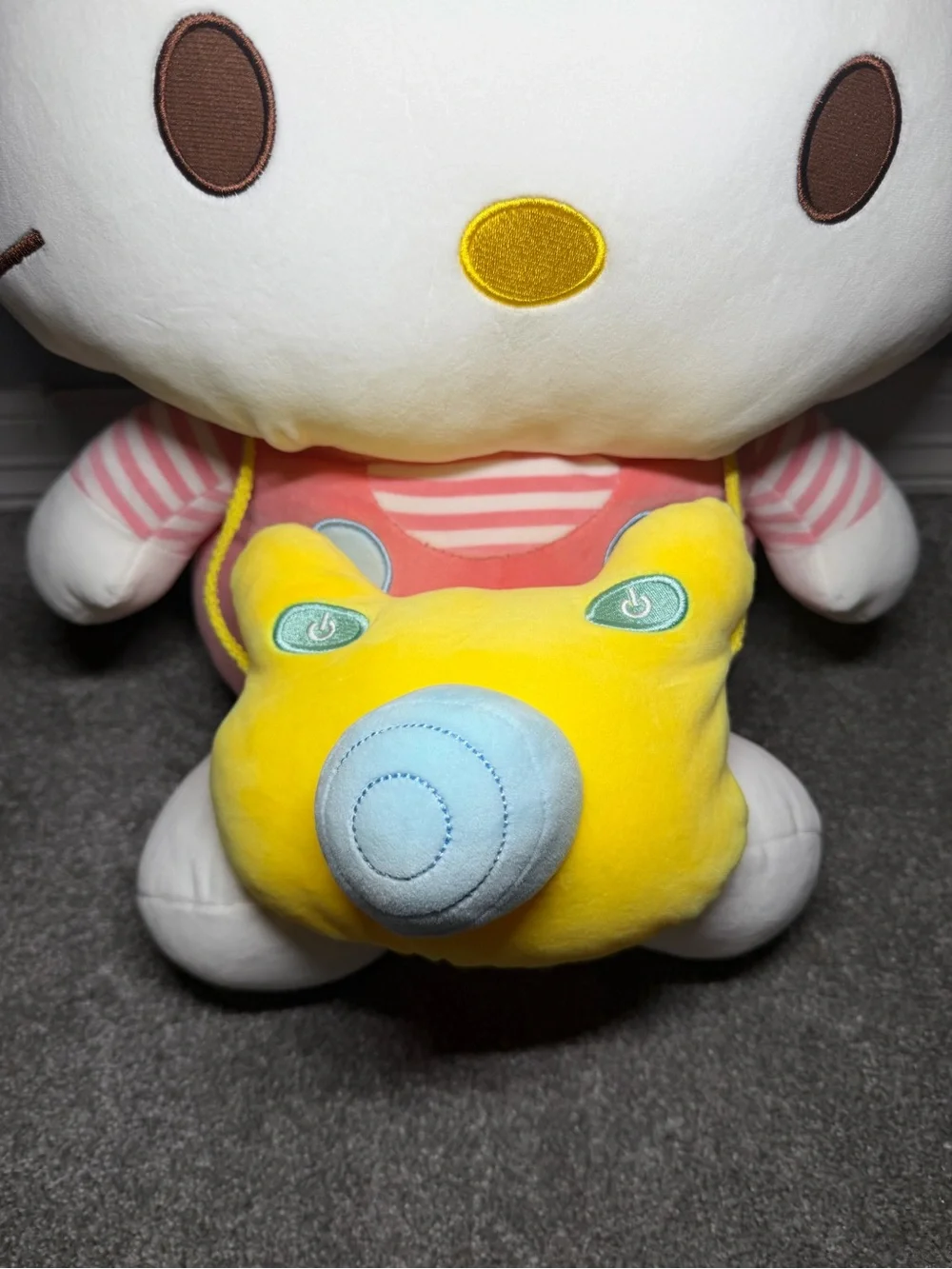 Jumbo sario hello kitty plush pink stripped shirt with yellow camera crossbody
